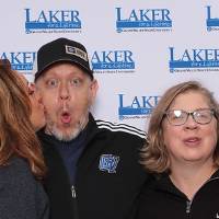 Group of couples kissing cheek